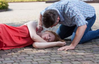 Woman Laying on Driveway from Pesticide Poisoning Charleston SC